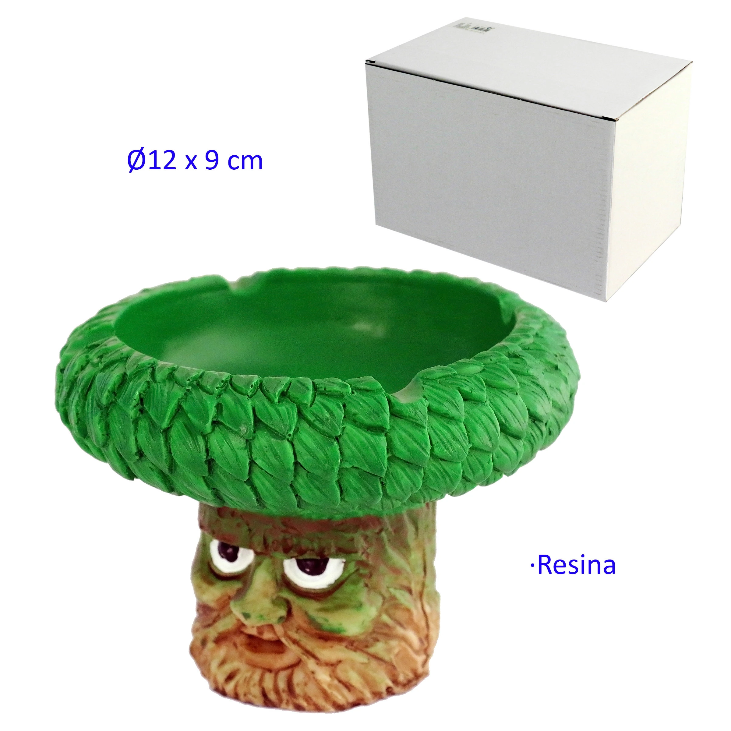 Cenicero con copa verde de hojas en relieve y base con rostro de árbol, acompañado de una caja blanca.