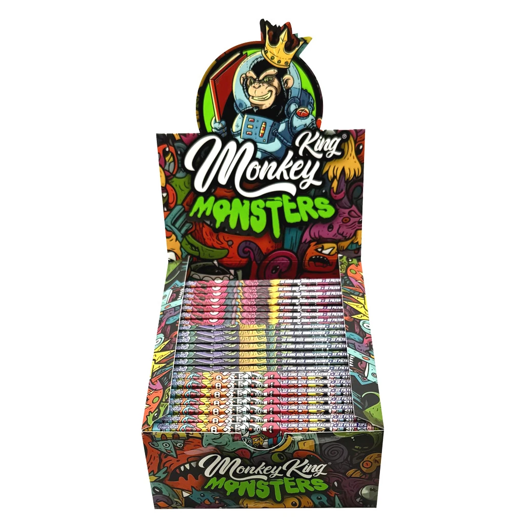 Expositor abierto de papel Monkey King Monsters con libritos apilados, dibujos multicolores y un mono coronado en la cabecera.