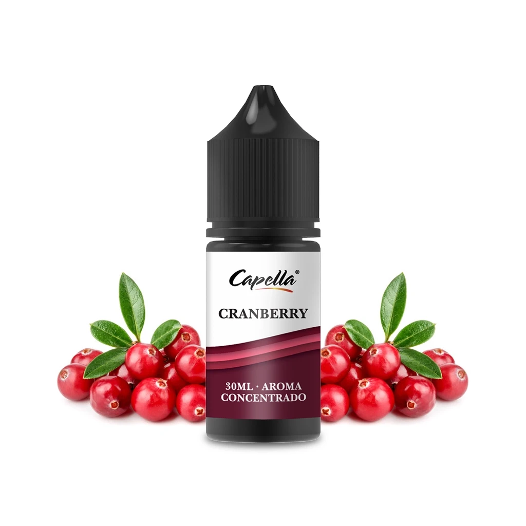 Frasco de aroma Capella Cranberry de 30 ml con tapón negro y etiqueta blanca y granate, rodeado de arándanos rojos y hojas verdes.