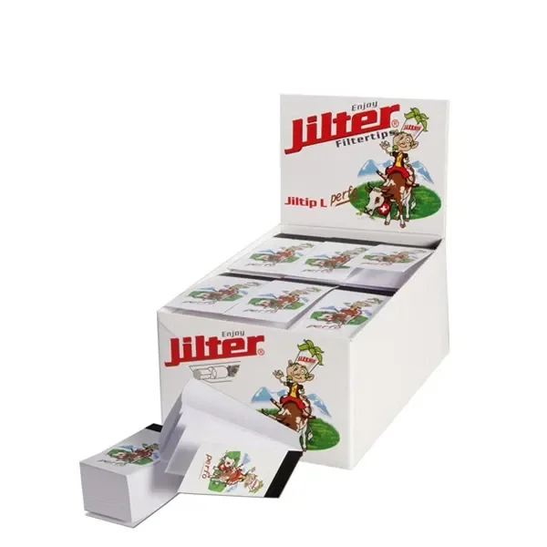 Expositor blanco de filtros Jilter Jiltip L con varias cajitas y un librito abierto delante, decorados con un personaje sobre un caballo.