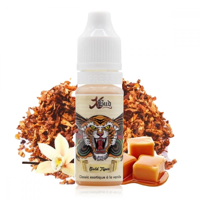 Frasco XBUD Gold Tiger con tapón blanco y un tigre en la etiqueta, acompañado de hojas de tabaco, una flor de vainilla y caramelos.