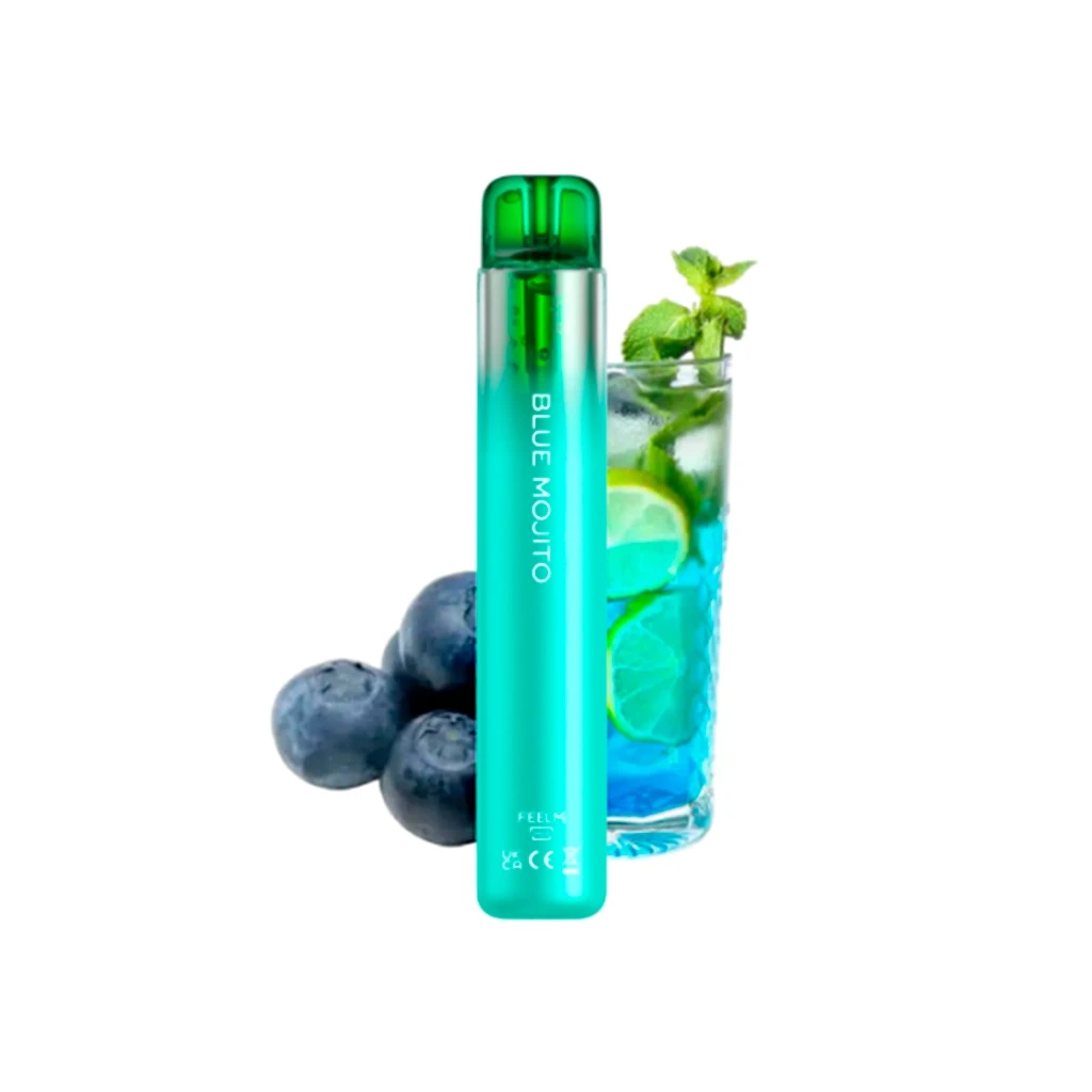 Vaper Blue Mojito de Vozol en tonos turquesa y verde, junto a arándanos y un vaso con bebida azul, lima y menta. Vaper Blue Mojito de Vozol en tonos turquesa y verde, junto a arándanos y un vaso con bebida azul, lima y menta.