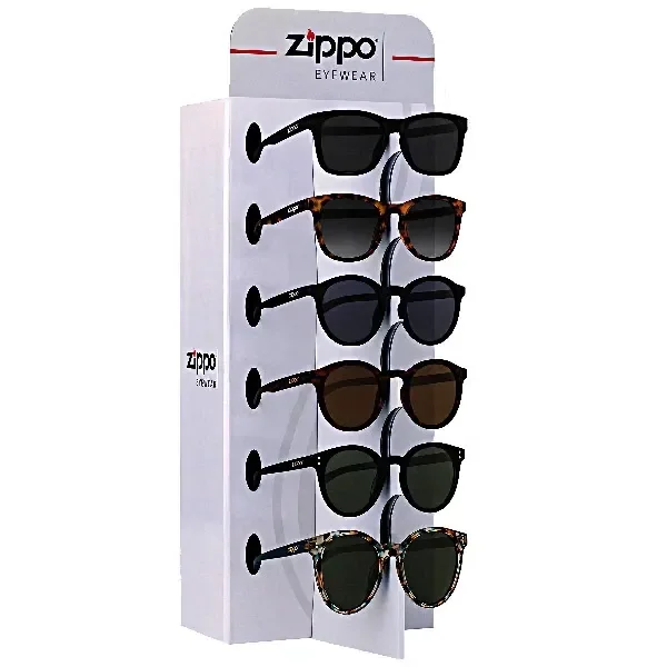 Expositor blanco Zippo Eyewear con varios modelos de gafas de sol, monturas negras y jaspeadas y lentes de distintos tonos.