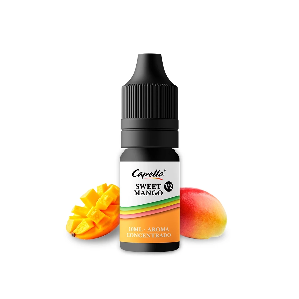 Frasco de aroma concentrado Capella Sweet Mango V2 con tapón negro y etiqueta de 10 ml, junto a un mango y una mitad cortada.