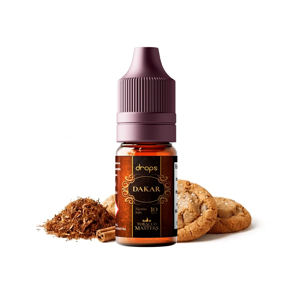 Frasco de e-líquido Drops Dakar con tapón morado y etiqueta Tobacco Masters, acompañado de tabaco, canela y galletas.