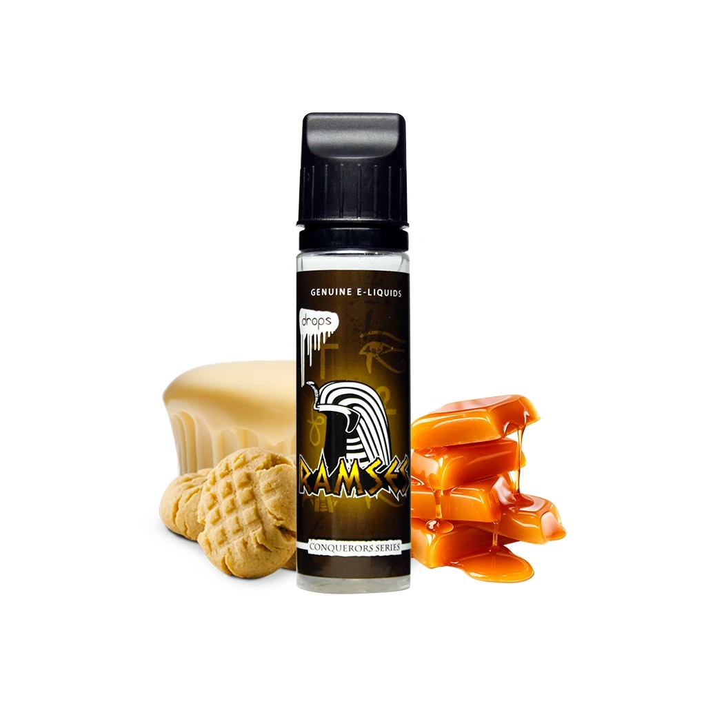 Frasco Drops Ramses con tapón negro y etiqueta de figura egipcia, acompañado de galletas, un bloque amarillo y caramelos con caramelo líquido.