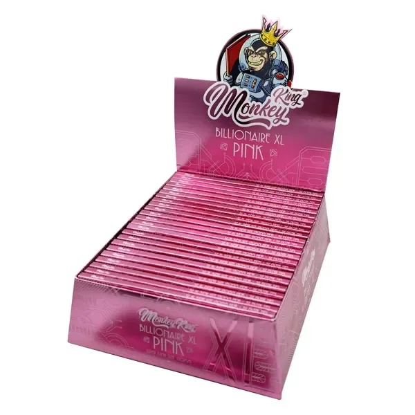 Expositor rosa abierto de papel Monkey King Billionaire XL Pink, con varias libretas alineadas y un mono coronado en la cabecera.