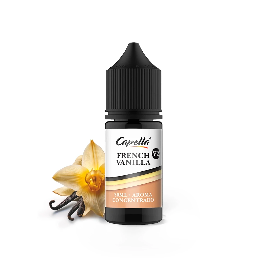 Frasco de French Vanilla V2 de Capella con tapón negro y etiqueta de 30 ml, acompañado de una flor y vainas de vainilla.