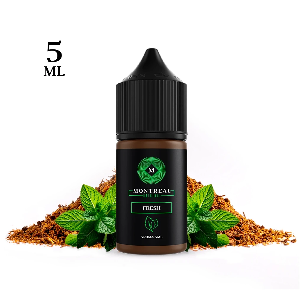 Frasco Montreal Original Fresh con tapón negro y etiqueta verde y negra, delante de hojas de menta y montículos de tabaco.