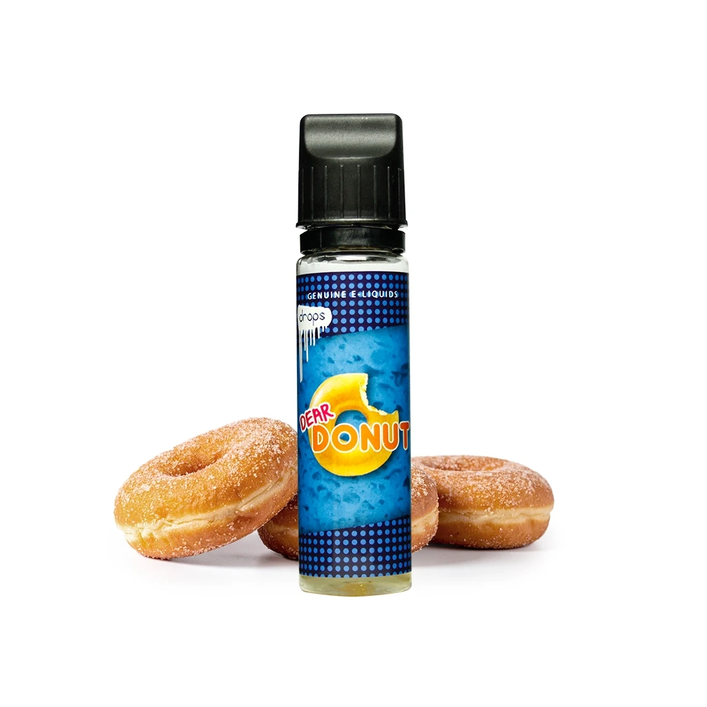 Frasco Drops Dear Donut con tapón negro y etiqueta azul con un donut dibujado, situado delante de varios donuts azucarados.