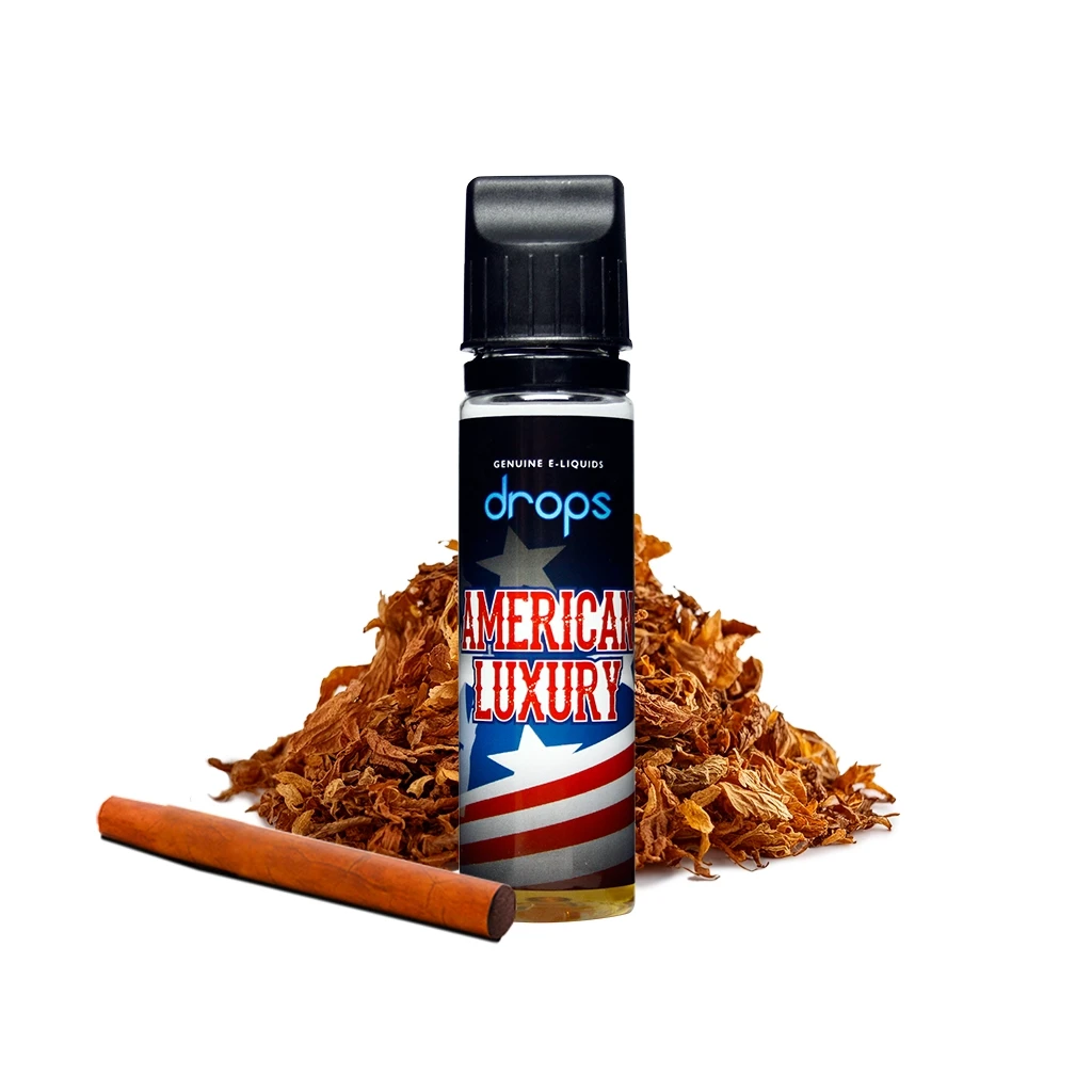 Frasco Drops American Luxury con tapón negro y etiqueta con estrellas y franjas, ante tabaco suelto y un cigarro marrón.