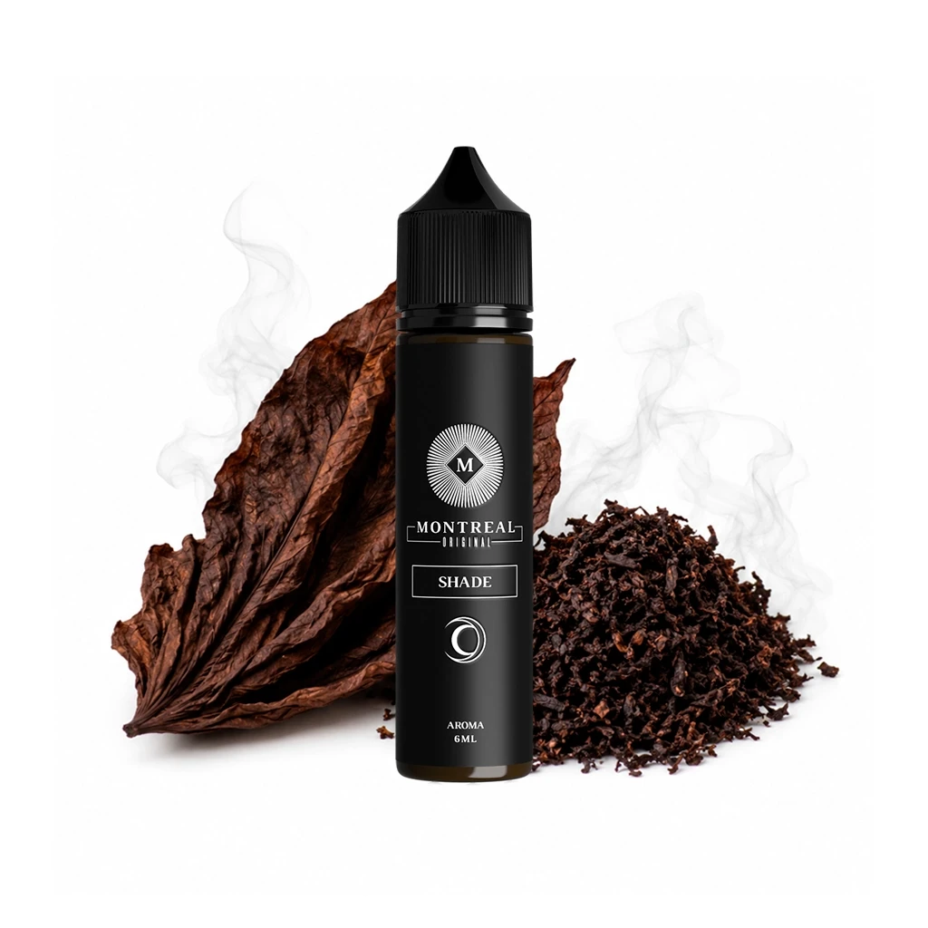Frasco negro Montreal Original Shade con etiqueta «Aroma 6 ml», delante de hojas marrones y una pila de tabaco picado, con volutas claras al fondo.