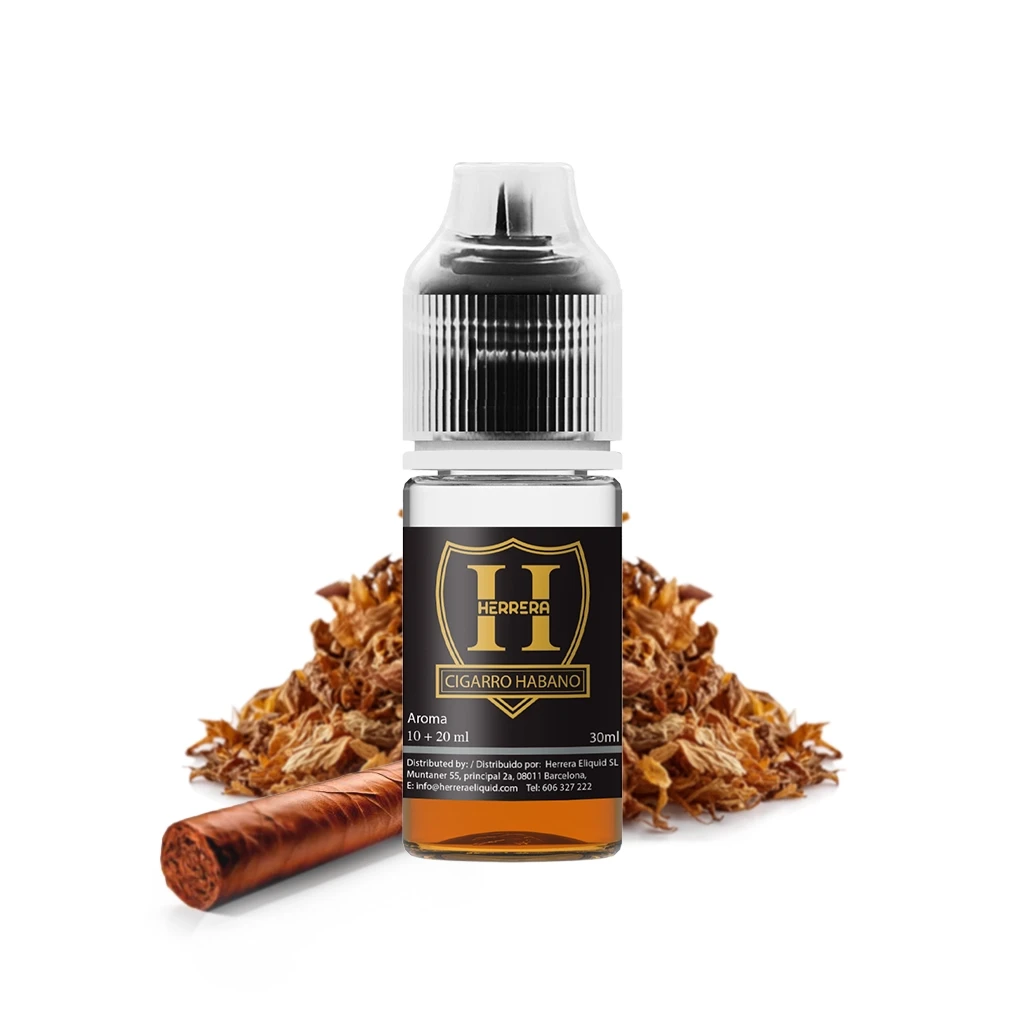 Frasco de aroma Herrera Cigarro Habano con líquido ámbar, etiqueta negra y dorada, junto a un cigarro y hojas de tabaco.