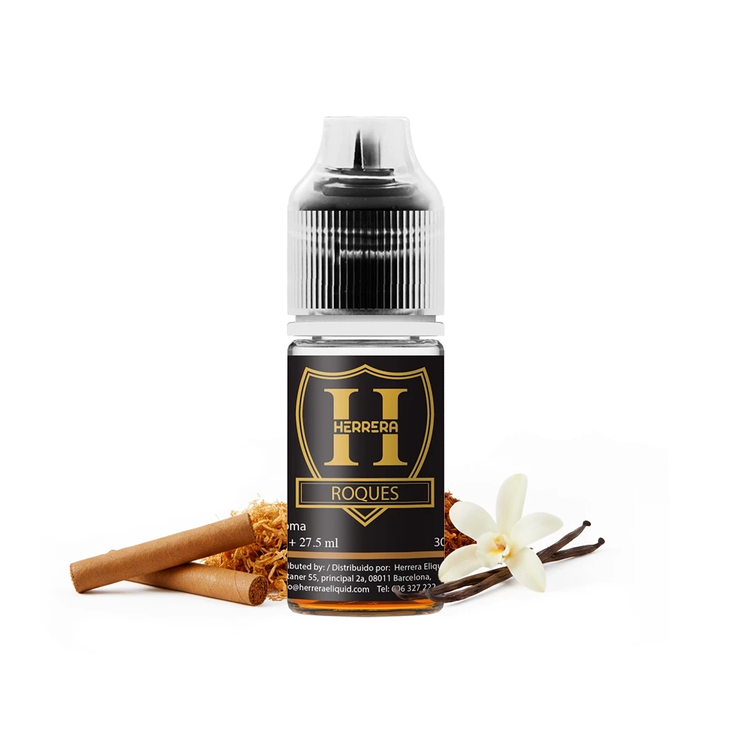 Frasco Herrera Roques Longfill con etiqueta negra y dorada, junto a cigarrillos marrones, tabaco suelto, una flor y vainas de vainilla.
