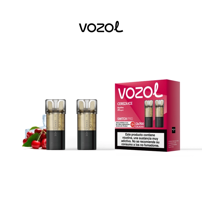 Pods Vozol Switch Pro Cereza Ice junto a su caja fucsia, con cerezas, cubitos de hielo y advertencia sobre nicotina en el envase. Pods Vozol Switch Pro Cereza Ice junto a su caja fucsia, con cerezas, cubitos de hielo y advertencia sobre nicotina en el envase.