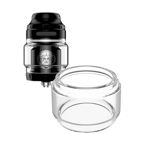 Cristal de recambio Geekvape Zeus Bulb transparente y abombado en primer plano, con un atomizador negro detrás sobre fondo blanco. Cristal de recambio Geekvape Zeus Bulb transparente y abombado en primer plano, con un atomizador negro detrás sobre fondo blanco.