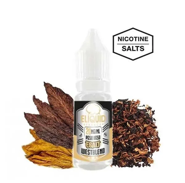 Frasco de Eliquid France Westblend E-Salt rodeado de hojas y tabaco picado, con un distintivo de sales de nicotina.