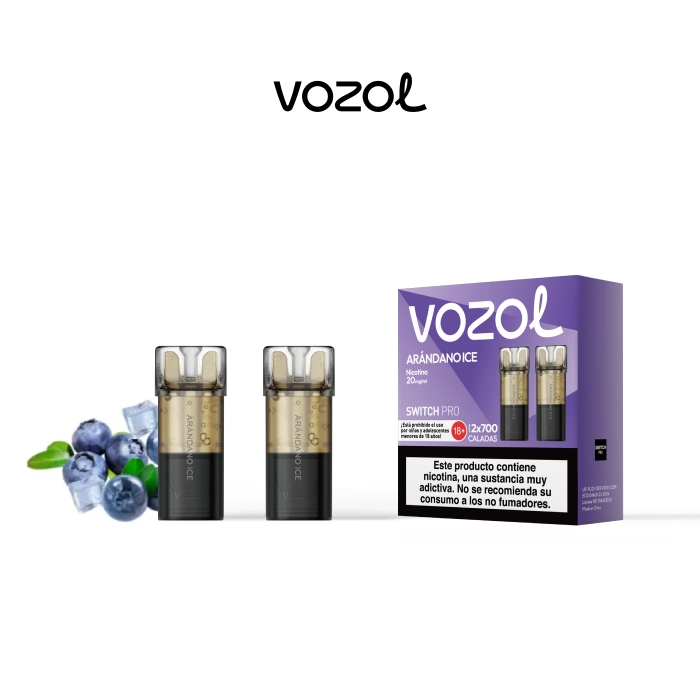 Pods Vozol Switch Pro Arándano Ice con base negra y depósito translúcido, junto a su caja morada y arándanos con cubitos de hielo.