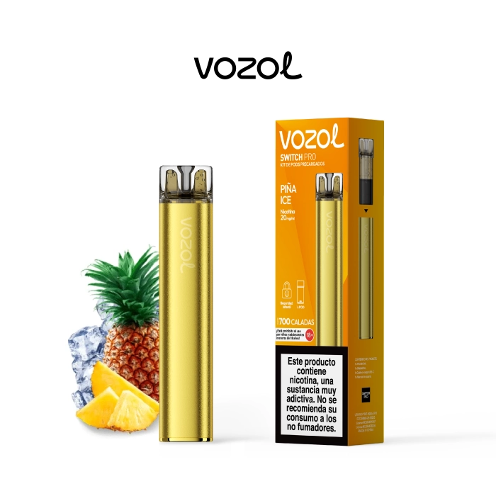 Vozol Switch Pro Piña Ice dorado junto a su caja naranja, con una piña, trozos de fruta y hielo sobre fondo blanco.