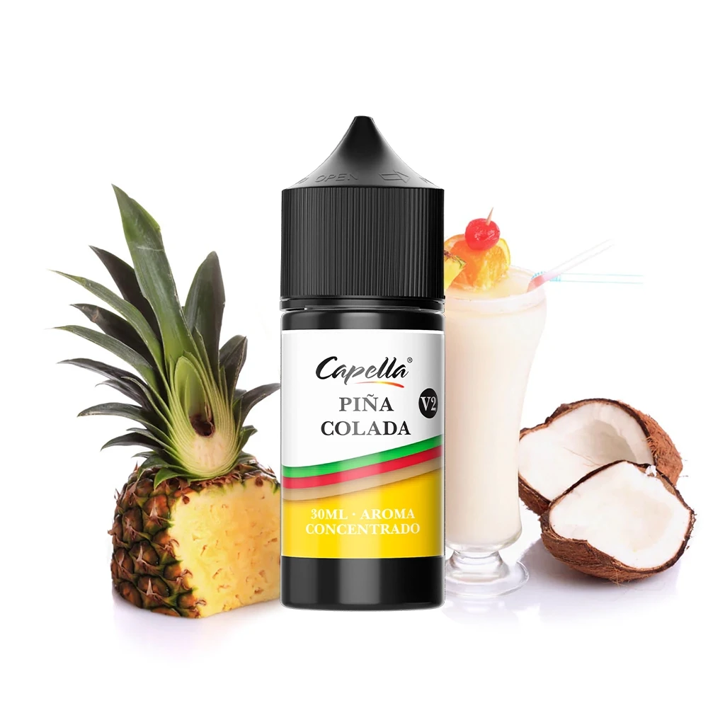 Frasco de aroma Capella Piña Colada V2 de 30 ml, con tapón negro, junto a una piña cortada, coco abierto y una copa de bebida.