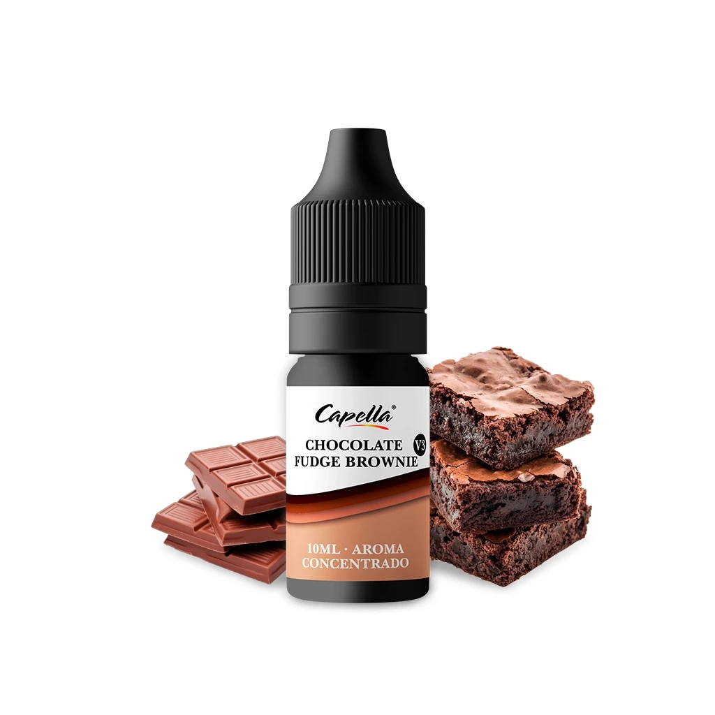 Frasco de aroma Capella Chocolate Fudge Brownie V3 de 10 ml, con tapón negro, junto a trozos de chocolate y brownies sobre fondo blanco.