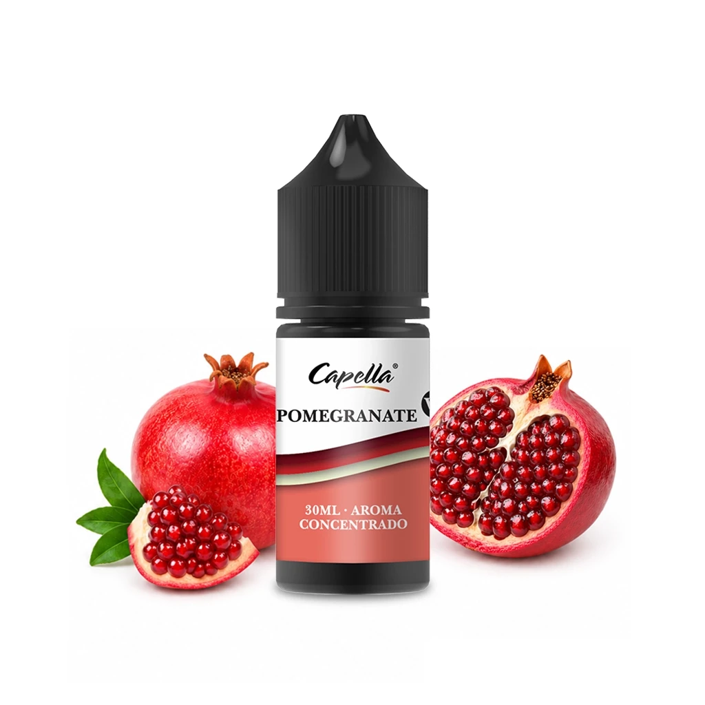 Frasco de aroma Pomegranate de Capella con tapón negro y etiqueta de 30 ml, rodeado de granadas enteras y abiertas.