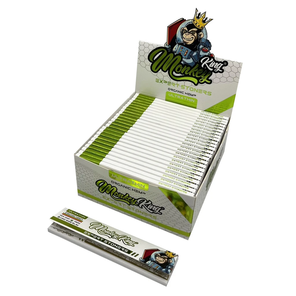 Expositor abierto de papel Expert Stoners de Monkey King, con varios libritos blancos y verdes y uno delante sobre fondo blanco.