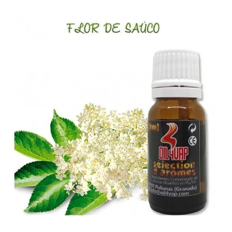 Frasco ámbar de aroma Flor de Saúco Oil4Vap con tapón blanco, junto a flores blancas y hojas verdes sobre fondo blanco.