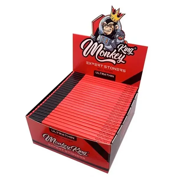 Expositor rojo abierto con varias unidades de papel Monkey King Expert Stoners, texto «Ultrathin» y un mono coronado en la cabecera.