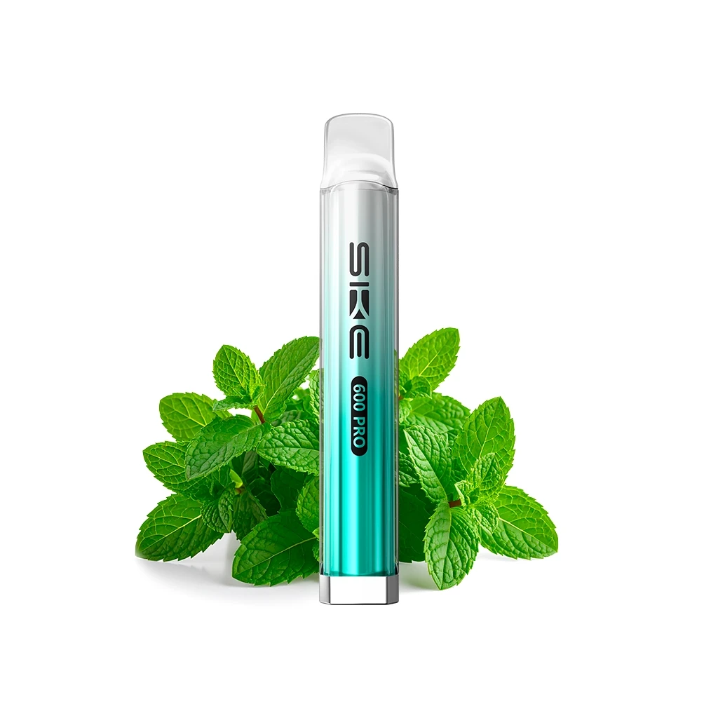 SKE Crystal 600 Pro Menthol de cuerpo turquesa y plateado, con boquilla transparente y hojas de menta detrás sobre fondo blanco.