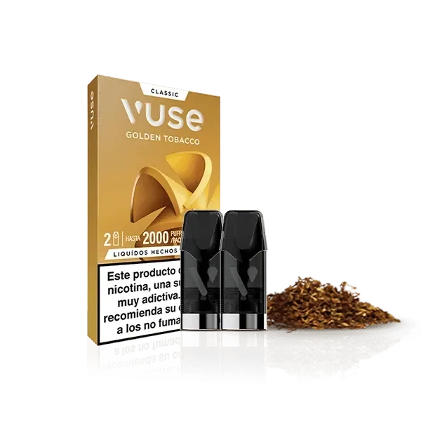 Pods negros Vuse Golden Tobacco junto a su caja dorada y un montón de tabaco, sobre fondo negro con reflejo.