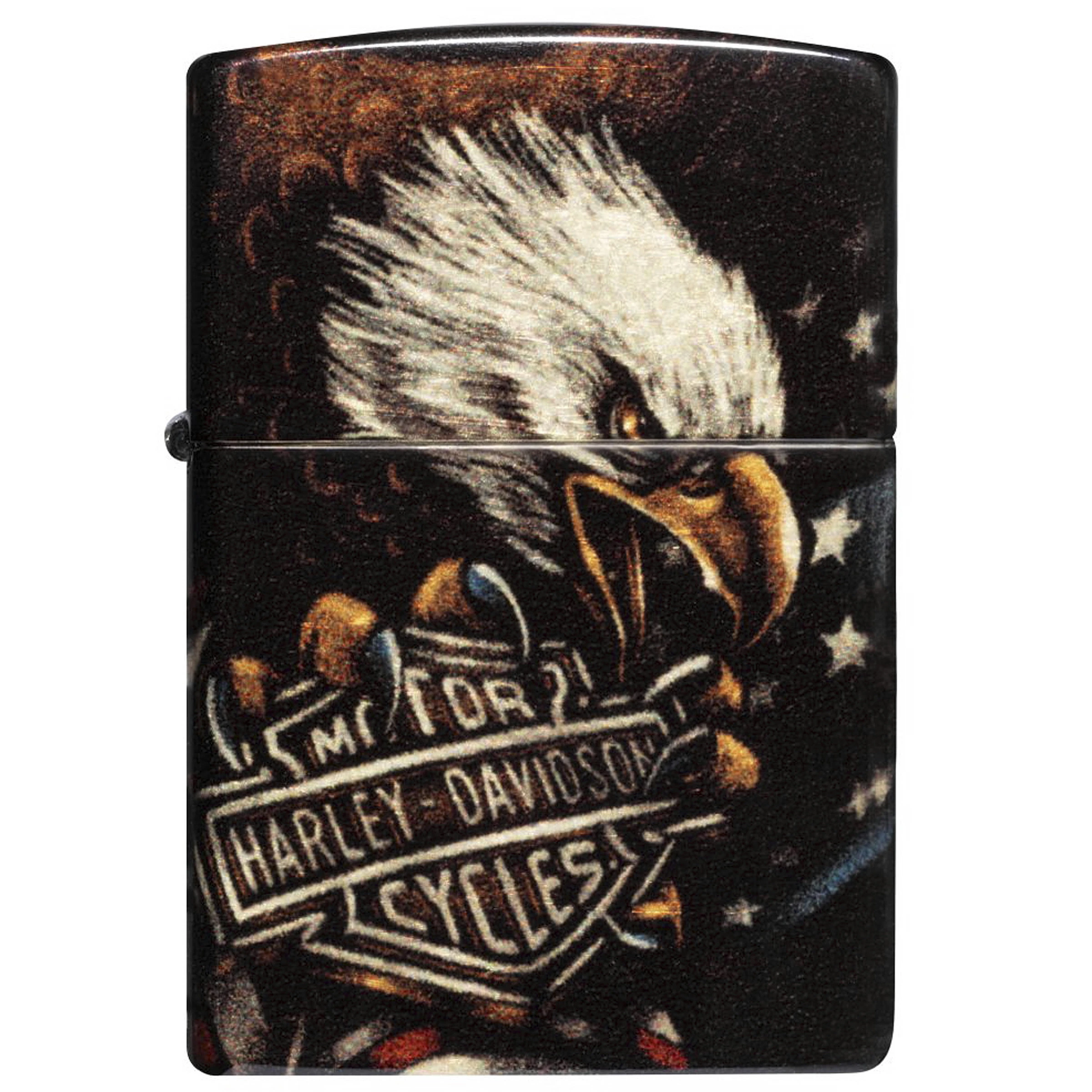 Encendedor Zippo cerrado, visto de frente, con un águila de cabeza blanca y el emblema Harley-Davidson sobre fondo oscuro con estrellas.