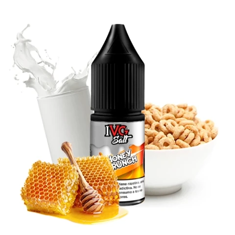 Frasco IVG Salts Honey Crunch con tapón negro, acompañado de un panal con miel, un vaso de leche y un cuenco de cereales.