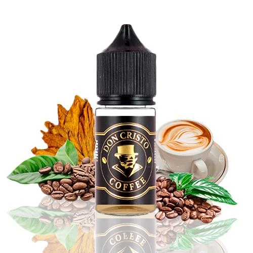 Frasco Don Cristo Coffee con tapón negro y etiqueta negra y dorada, acompañado de granos de café, hojas y una taza de café con espuma.