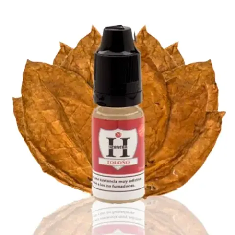 Frasco de e-líquido Herrera Salts Toloño con etiqueta roja y tapón negro, ante hojas secas de tabaco sobre fondo blanco.