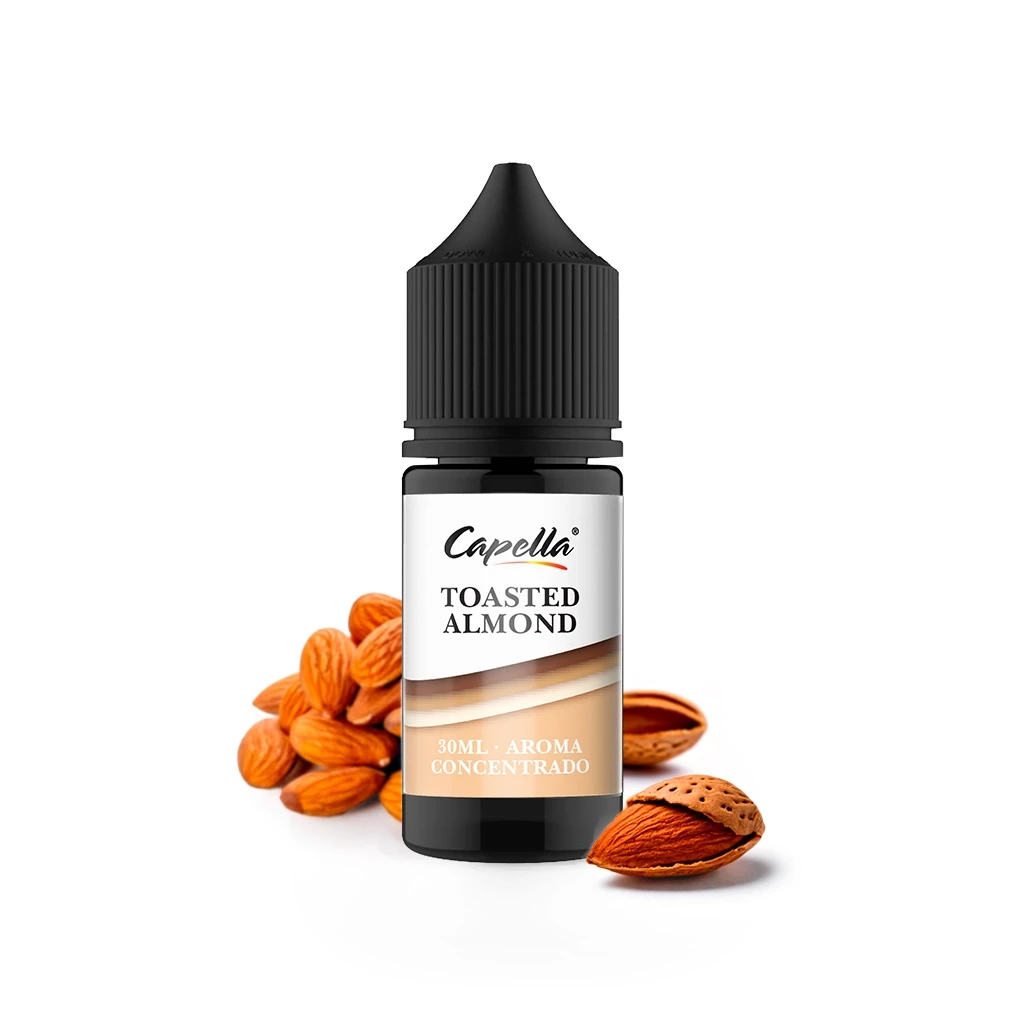 Frasco de aroma concentrado Capella Toasted Almond de 30 ml, con tapón negro y almendras alrededor, sobre fondo blanco.