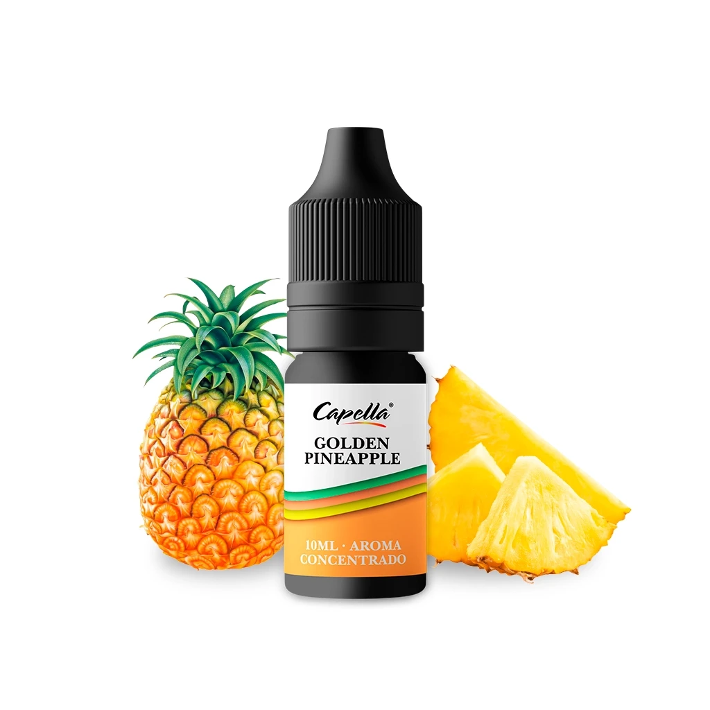 Frasco negro de Golden Pineapple de Capella, con etiqueta de aroma concentrado de 10 ml, junto a una piña y trozos de pulpa amarilla.