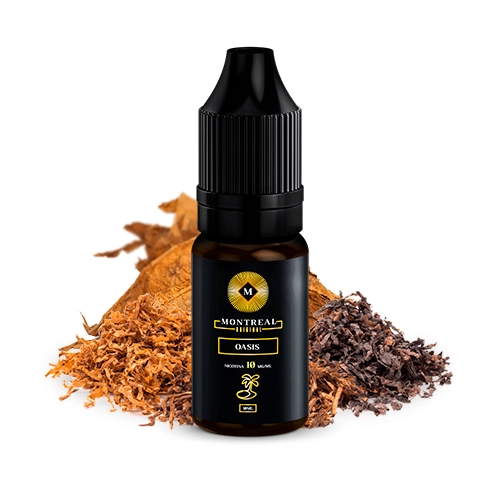 Frasco Montreal Original Oasis con tapón negro y etiqueta negra con letras doradas, delante de hojas y montones de tabaco.