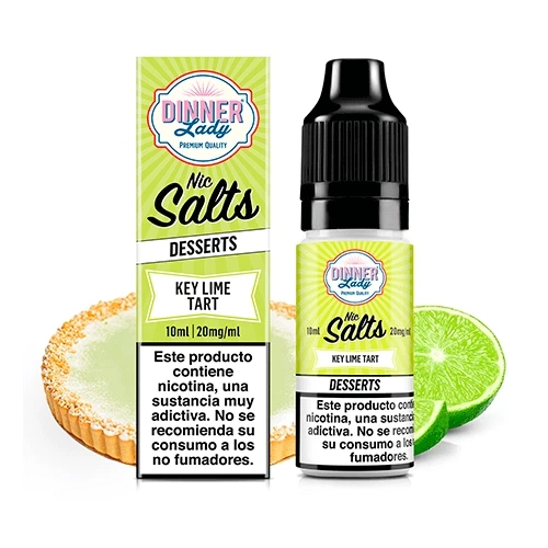 Frasco y caja Dinner Lady Key Lime Tart Nic Salt, con etiquetas verdes y advertencia de nicotina, junto a una tarta y lima cortada.