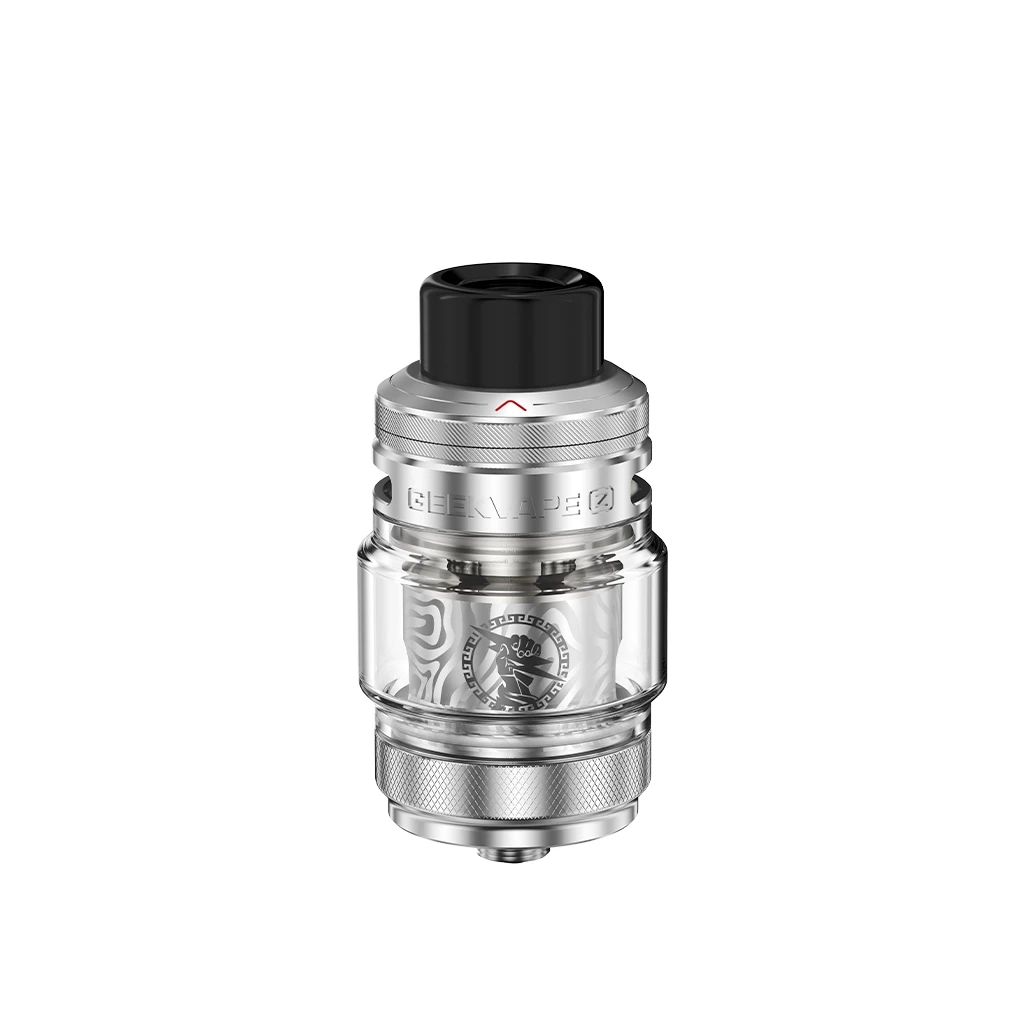 Depósito Geekvape Z Subohm Tank con cuerpo metálico gris, cámara transparente y boquilla negra, aislado sobre fondo blanco. Depósito Geekvape Z Subohm Tank con cuerpo metálico gris, cámara transparente y boquilla negra, aislado sobre fondo blanco.