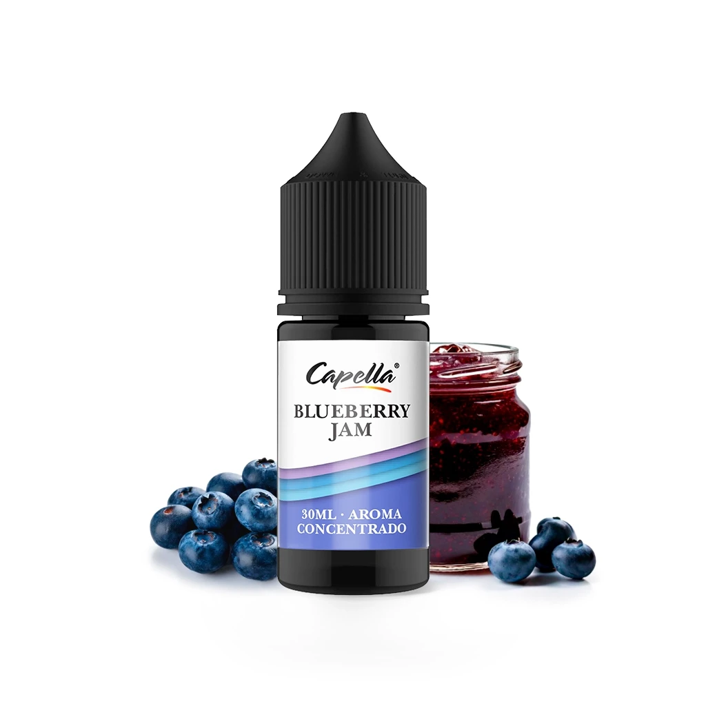 Frasco de aroma Capella Blueberry Jam de 30 ml con tapón negro, acompañado de arándanos y un tarro de mermelada sobre fondo blanco.