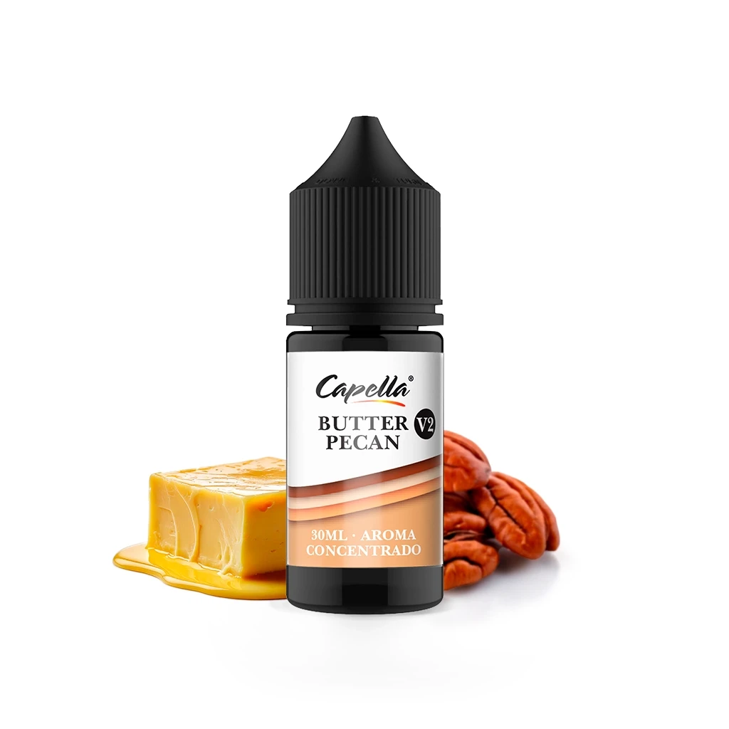 Frasco Capella Butter Pecan V2 con tapón negro y etiqueta de aroma concentrado de 30 ml, junto a mantequilla y nueces pecanas.