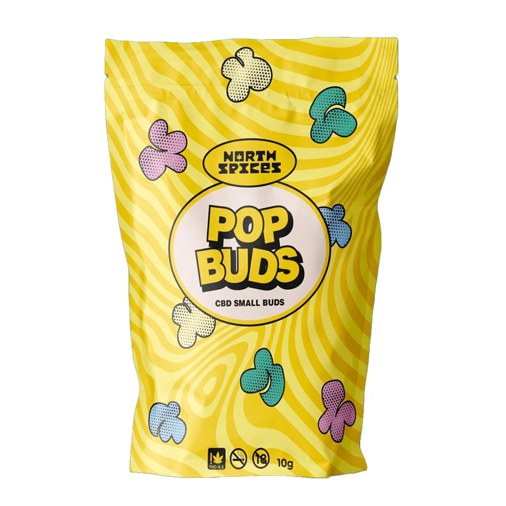 Bolsa amarilla North Spices Pop Buds con ondas, figuras de colores y las inscripciones «CBD Small Buds» y «10 g», sobre fondo blanco.