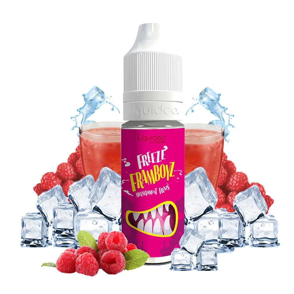 Frasco de e-líquido Framboyz Freeze con etiqueta fucsia y tapón blanco, rodeado de frambuesas, cubitos y vasos de bebida roja.