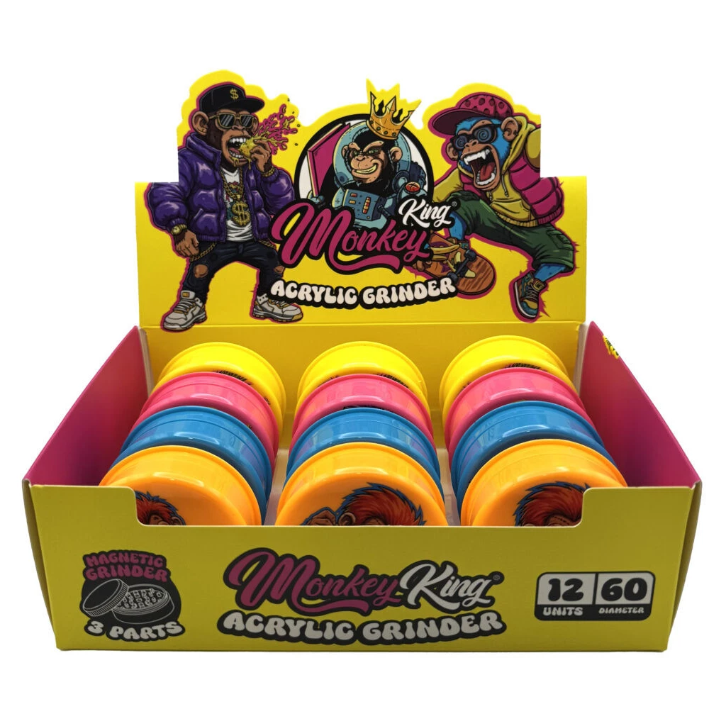 Expositor amarillo Monkey King con varios grinders redondos amarillos, rosas, azules y naranjas, decorado con monos ilustrados.