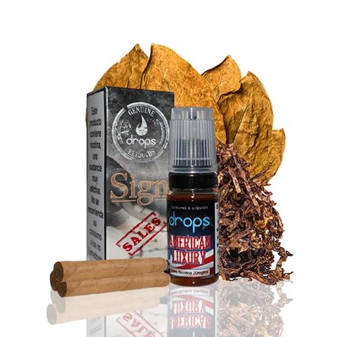 Frasco de e-líquido Drops Salts American Luxury con su caja, hojas de tabaco, tabaco picado y cigarros sobre fondo blanco.