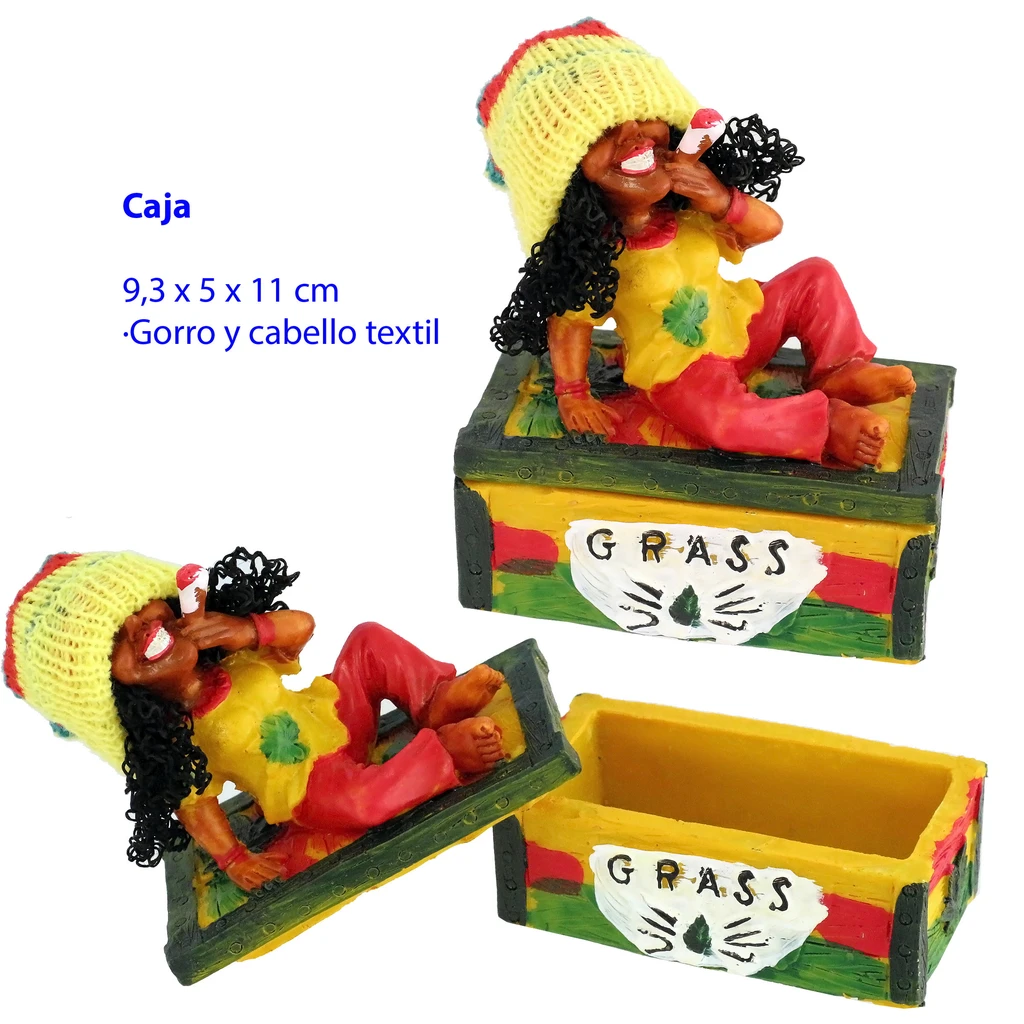 Caja Rasta mostrada abierta y cerrada, con figura recostada de gorro amarillo en la tapa y la palabra GRASS en el frontal.