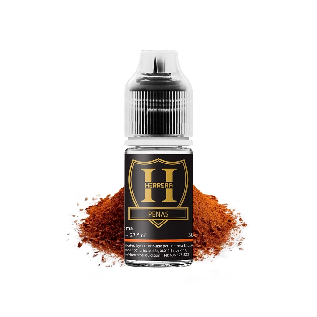 Frasco Herrera Peñas Longfill con etiqueta negra y dorada y tapón transparente, ante un montículo de polvo marrón rojizo.