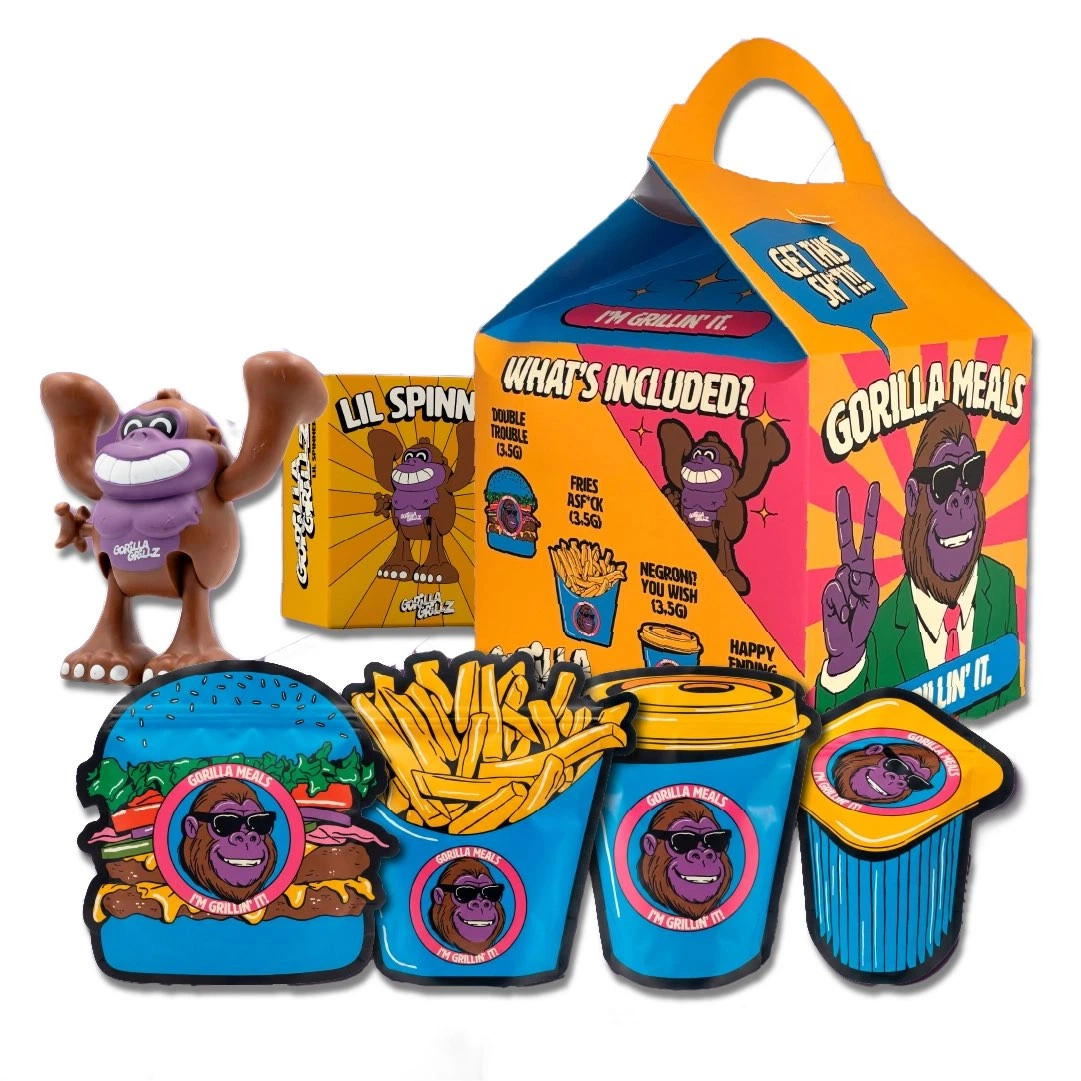 Gorilla Meal con caja de asa, figura de gorila y envases ilustrados con formas de hamburguesa, patatas fritas, bebida y postre.