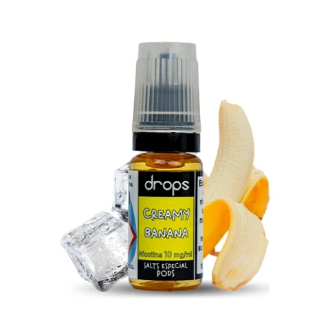 Frasco Drops Bar Salts Creamy Banana con tapón translúcido y etiqueta amarilla, acompañado de un plátano pelado y cubitos de hielo.